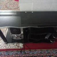 یک عدد زیر تلویزیون شیشه‌ای|میز تلویزیون|شیراز, جانبازان|دیوار