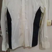 یک عدد کاپشن وژاکت و پیراهن|لباس|رشت, منظریه|دیوار