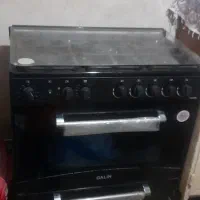 اجاق گاز   ۵ شعله  طرح فر   مشکی    در  شیشه ای