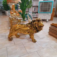 مجسمه کنار سالنی شیر ورق طلا اک