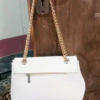 کیف رنگ شیری|کیف، کفش، کمربند|قم, قلعه کامکار|دیوار