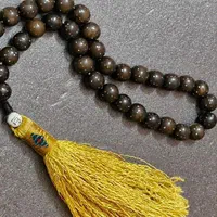 ** تسبیح هسته خرما با نقره و مس کوب **
