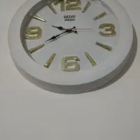 ساعت پشتی یه تابلو فرش.ماشینی بدون قاب