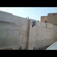 یک  استادکارسنگ نما ودوکارگرروزمزد