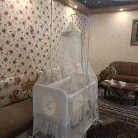 تخت نوزاد و پشه بندninico