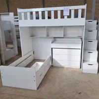 تخت خواب دوطبقه همراه با کشو و میز تحریر