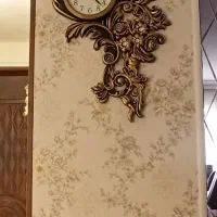 ساعت دیواری طلایی طرح گل