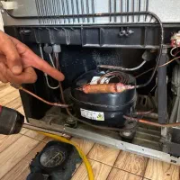 تعمیرانواع یخچال فریزر با(ضمانت)درب محل