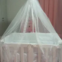 گهواره کنار تخت مادر