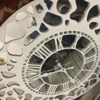 ساعت دیواری ایینه کاری شده