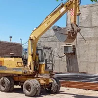 بیل مکانیکی لاستیکی اچ ای ۱۰۰.مینی بیل