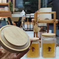 بانکه شیشه ای درب چوبی/پاسماوری/ادویه/حبوبات|ظروف نگهدارنده، پلاستیکی، یک‌بارمصرف|مشهد, حجاب (شهرک غرب)|دیوار