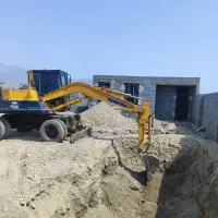 خدمات مینی بیل میکانیکی چرخ لاستیکی