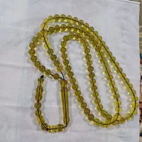 تسبیح سندلوس زرد اب حیاط تراش استاد آکو