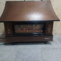 بخاری و فرش و زیر تلویزیون