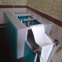 دستگاه رول کن سفره یکبارمصرف و زباله و کیسه فریزر