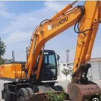 بیل مکانیکی لاستیکی اجاره ای- شهرک صنعتی شیراز