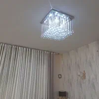 یک جفت لوستر ریموت دار کریستال با بدنه استیل