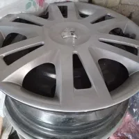 تعدادی وسیله ، رینگ 15 و چهارپایه کولر