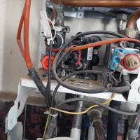 تعمیرات ورسوبگیری پکیج و ابگرمکن فوری درمحل