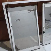 پنجره الومنیومی باشیشه رفلکس طلایی