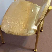 یک عدد صندلی فلزی طلایی