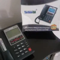 گوشی تلفن ثابت رومیزی تکنوتل به همراه میز تلفن