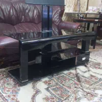 میز تمام شیشه دودی زیر تلویزیونی
