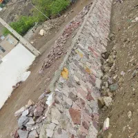 اوستا کار دیوار چینی با سنگ لاشه نما