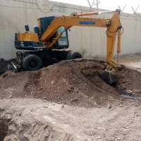 خدمات مینی بیل میکانیکی چرخ لاستیکی|خدمات پیشه و مهارت|رودان, |دیوار