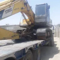 بیل مکانیکی زنجیری مجهز به چنگ و مگنت