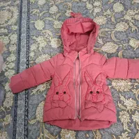 کاپشن پچگانه، کاپشن سرهمی نوزاد