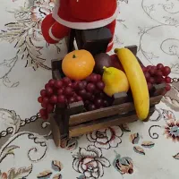 عروسک بابانوئل و چرخ تزیینی مخصوص سفره شب یلدا