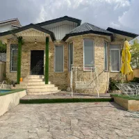 باغچه-ویلایی-سندتکبرگ-محوطه-سازی-شده-دوخواب