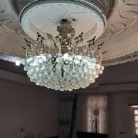 لوستر ۱۶ شاخه همراه دیوار کوب برنز