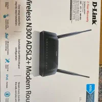 مودم وایرلس و میز کامپیوتر