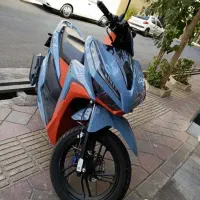 فروش موتور کلیک کویر ۱۵۰ درحد.رنگ نارنجی مازراتی