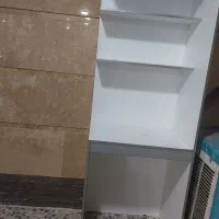 کمد که کتابخانه وقسمت پایین میز تحرییر