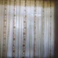 یک پرده حریر هشت متر با چوب پرده طلایی