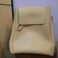 کوله پشتی چرم کرم استخوانی