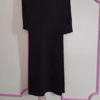 یک عدد شلوار مشکی پارچه ای زنانه