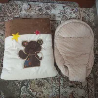 کیسه خواب وآغوشی نوزاد