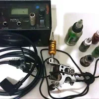 دستگاه تتو با رنگ و ابزار و سوزن