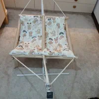 گهواره دوقلو ، قنداق سوئیسی ، قنداق چسبی ، تشکچه