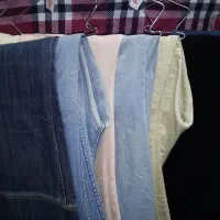 تعدادی شلوار شلوار لی شلوار پارچه ای