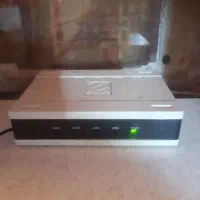 مودم2پورت باآداپتورش کارکرده+یه آویزگردنی قدیمی
