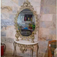 آیینه و کنسول برنجی به همراه شمعدان