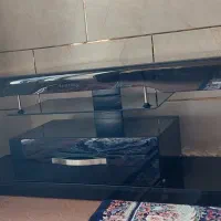 زیر تلویزیون شیشه ای در حد نو