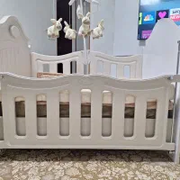 تخت بچه همراه با عروسک موزیکال و تشک خوشخواب