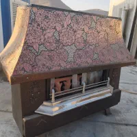 بخاری تمیز سالم دوتا و ویترین جلو آشپزخانه فروشی